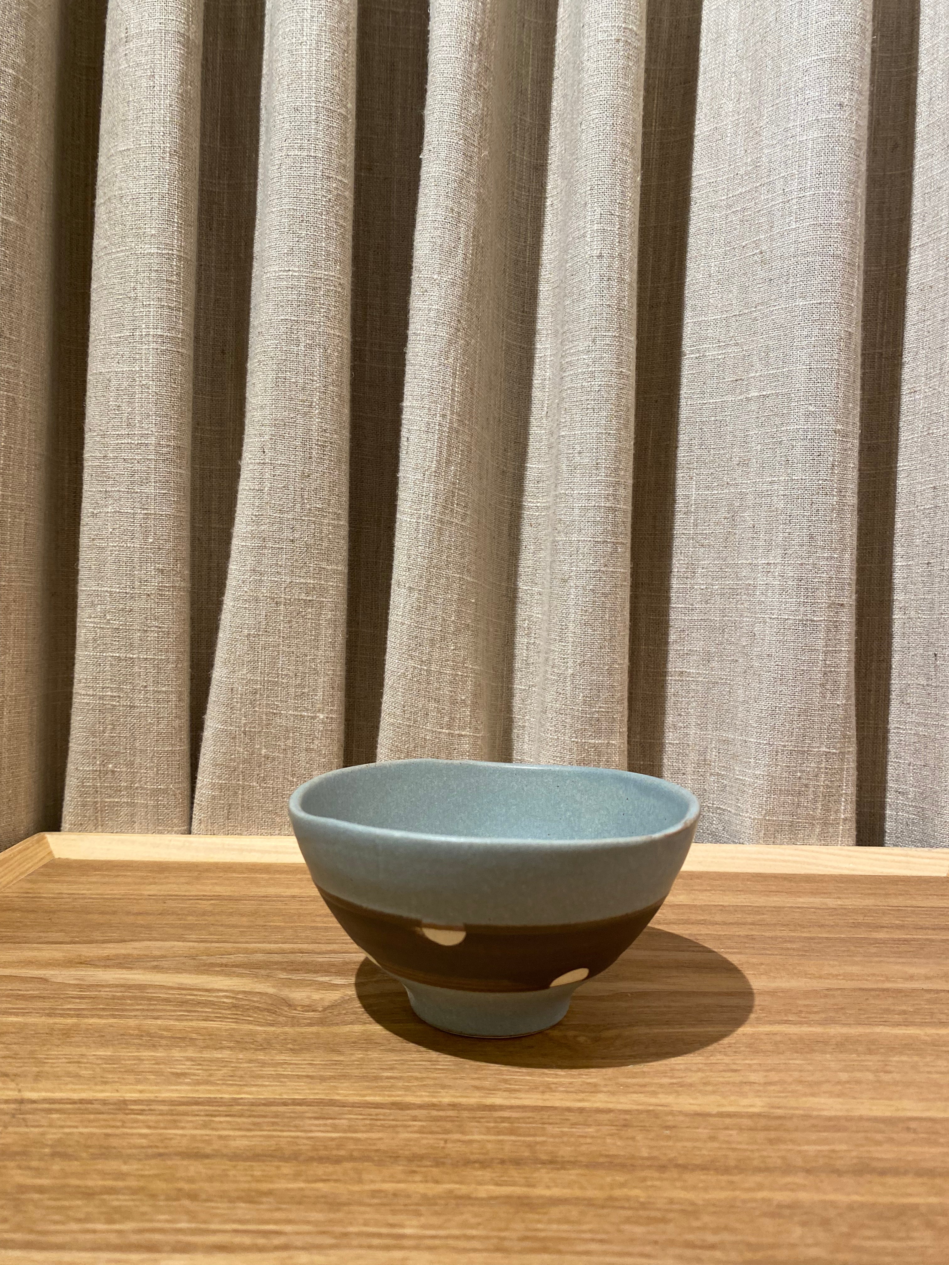 Bowl in blue and brown glaze with white dots