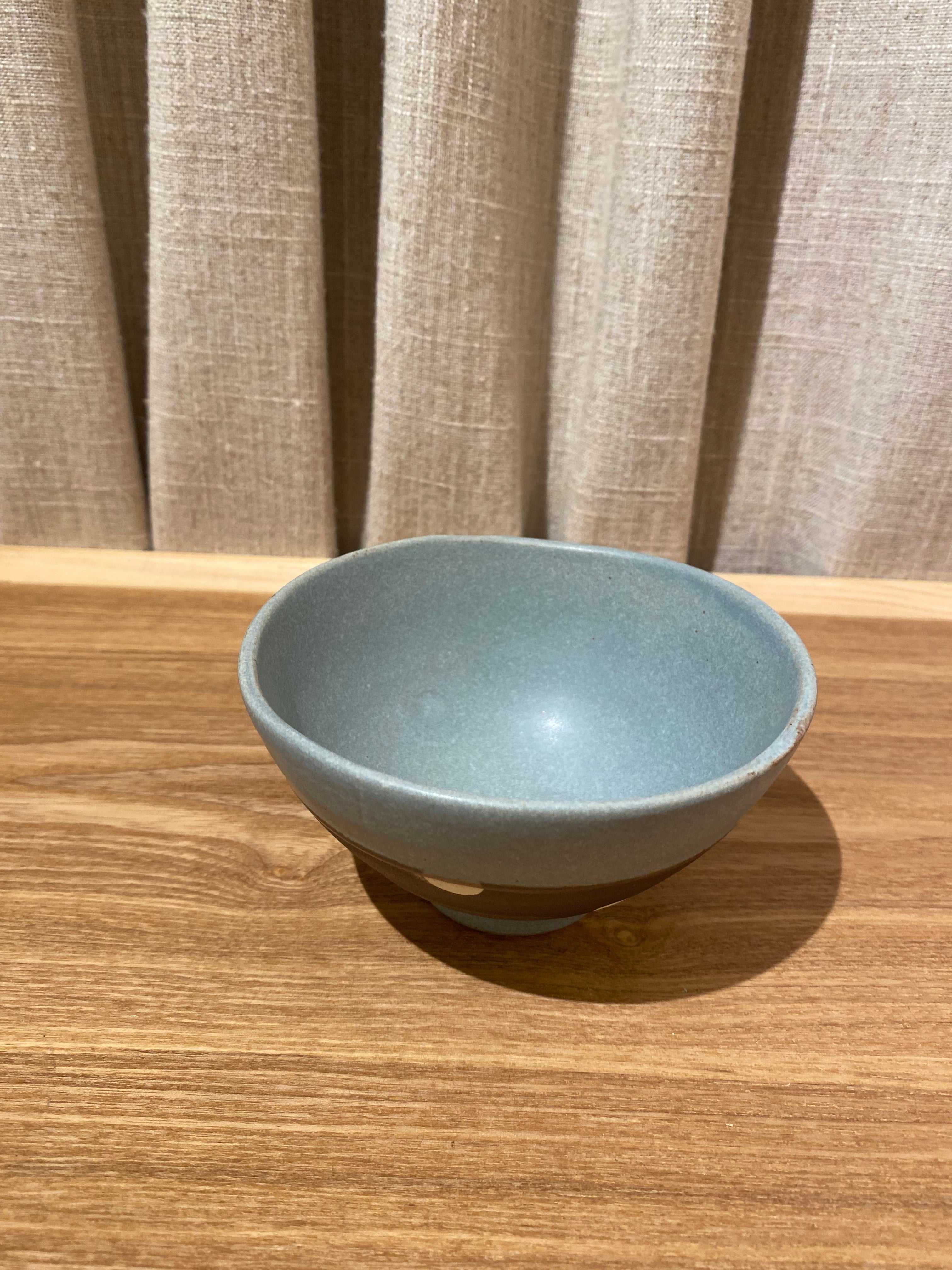 Bowl in blue and brown glaze with white dots