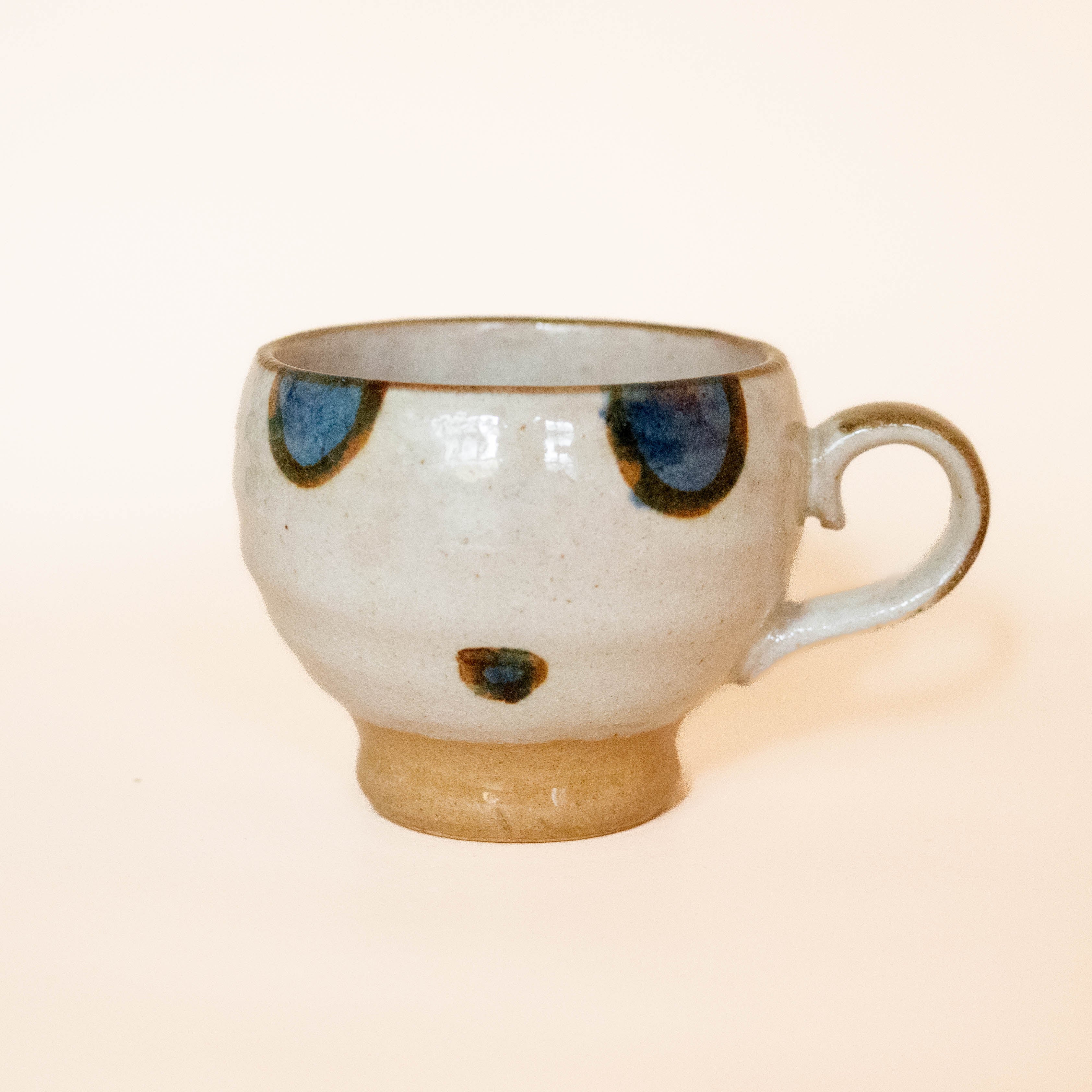 Japanese cup with blue/brown circles and dots