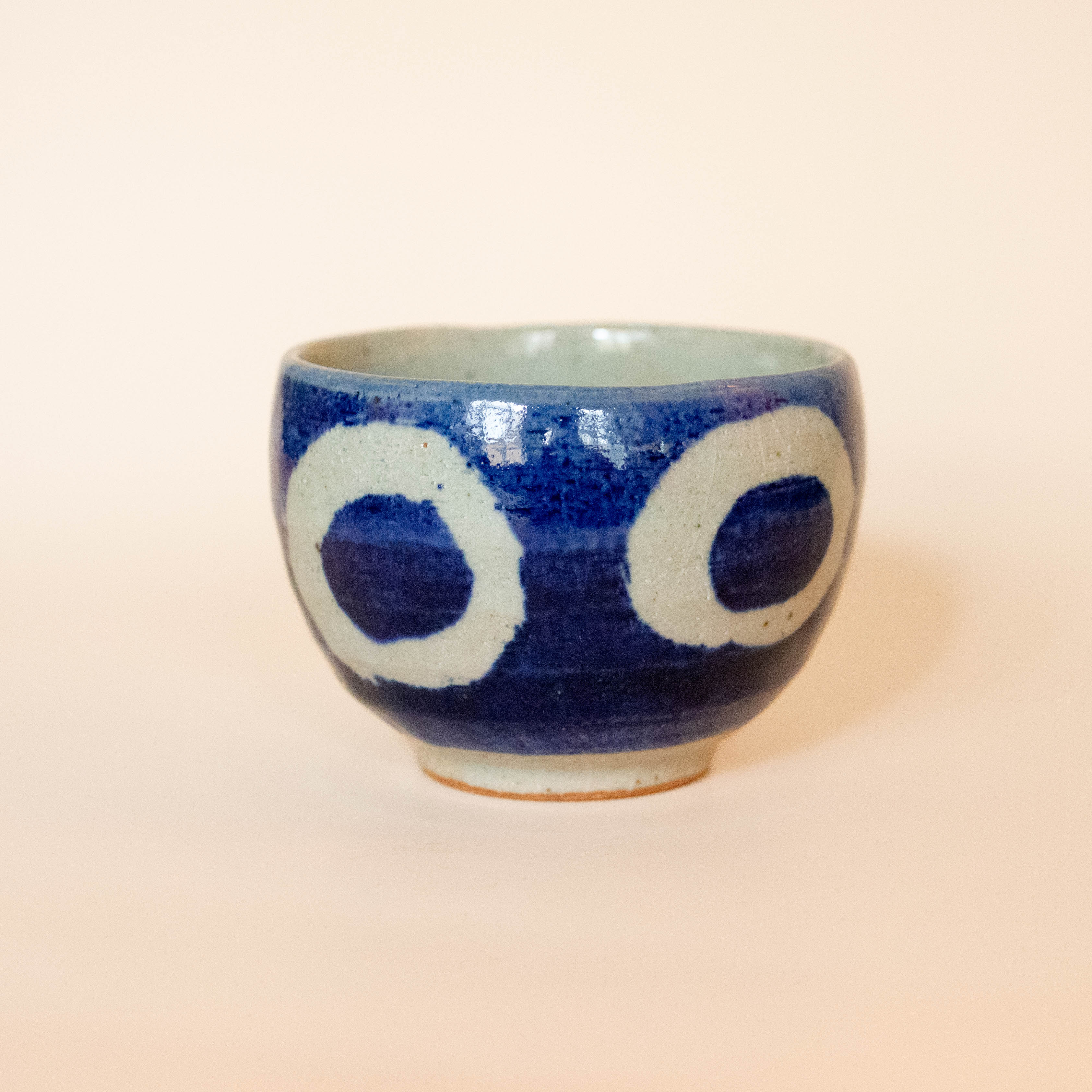 Blue ceramic cup with white rings