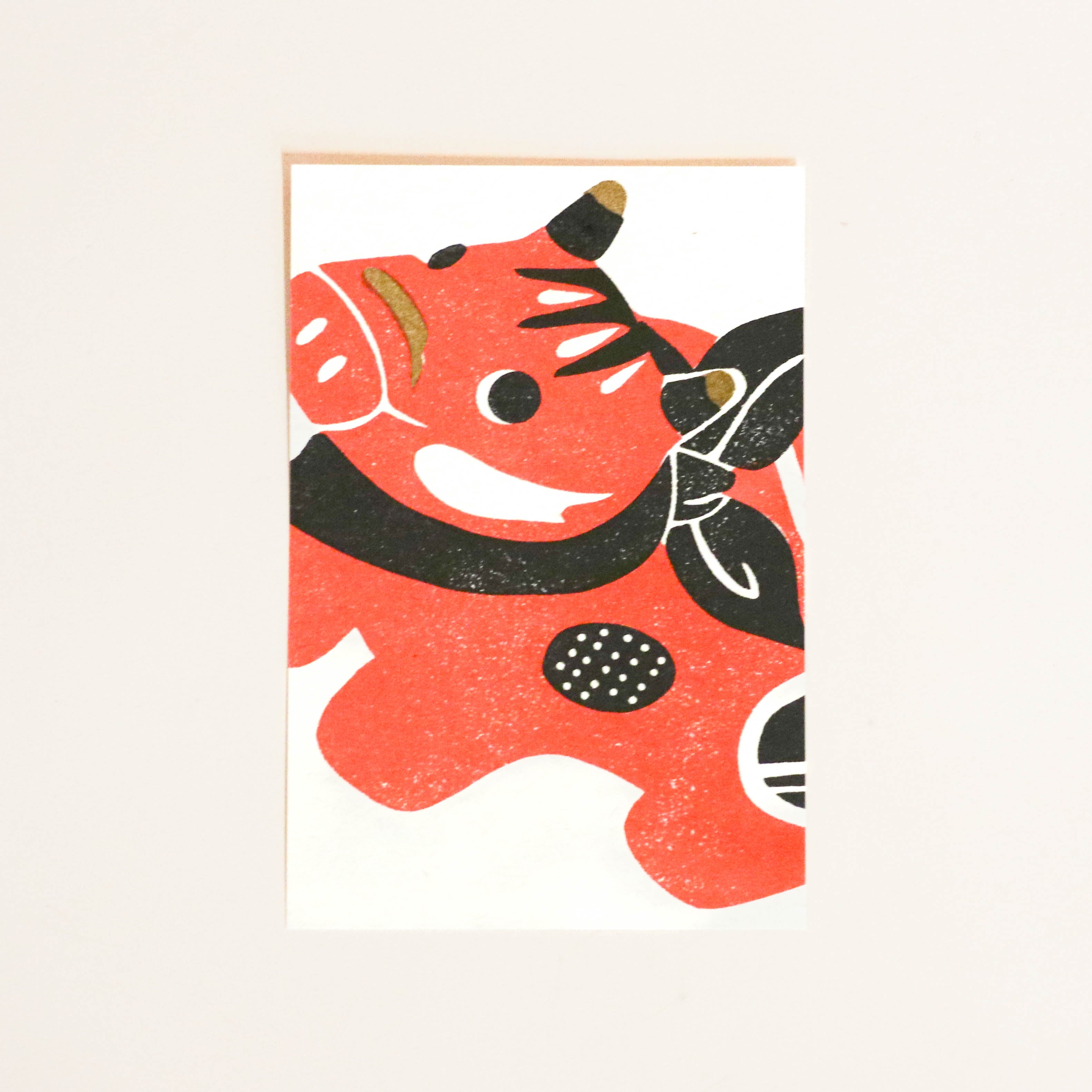 Postcard with red cow and black details