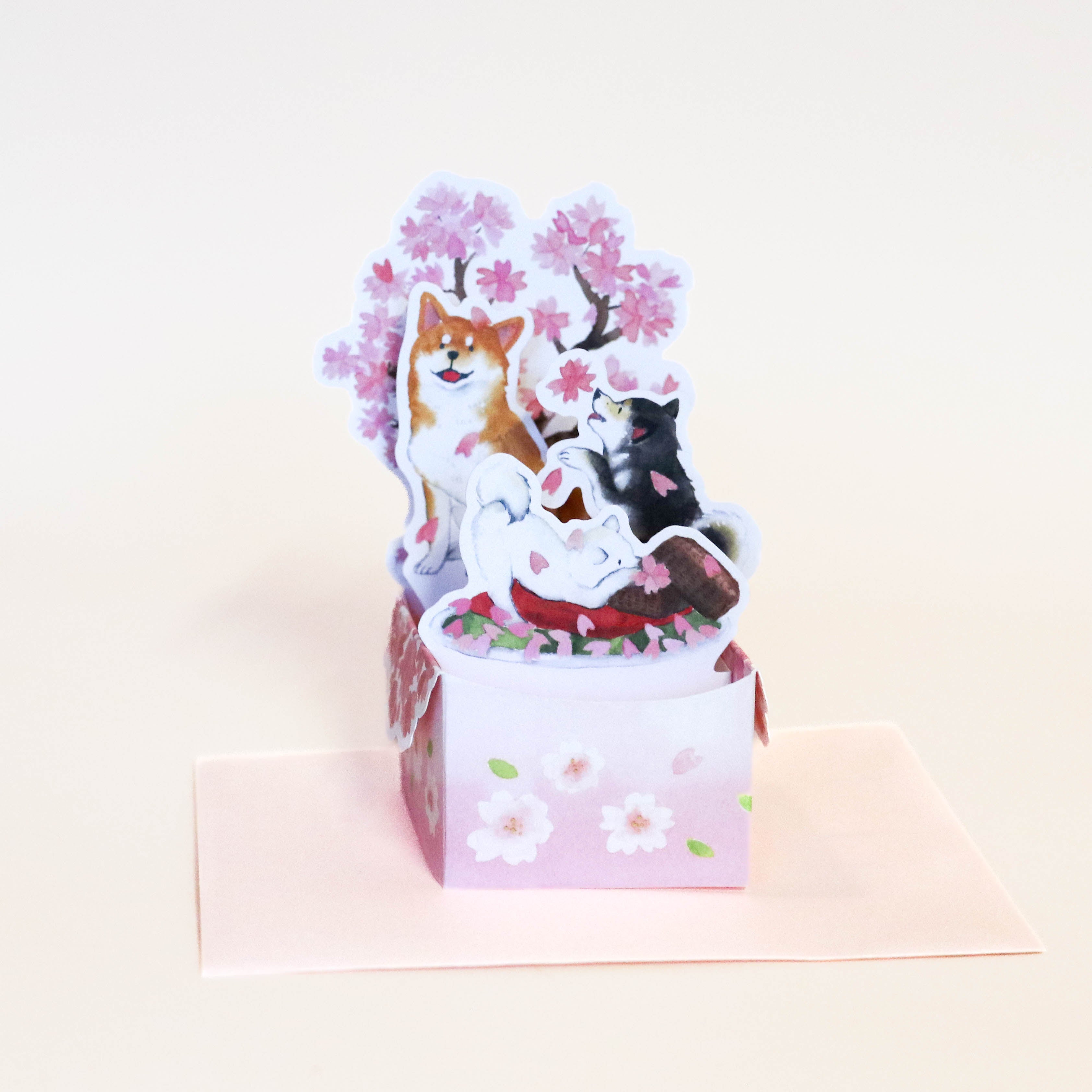 Fold-out card with Shiba and sakura tree