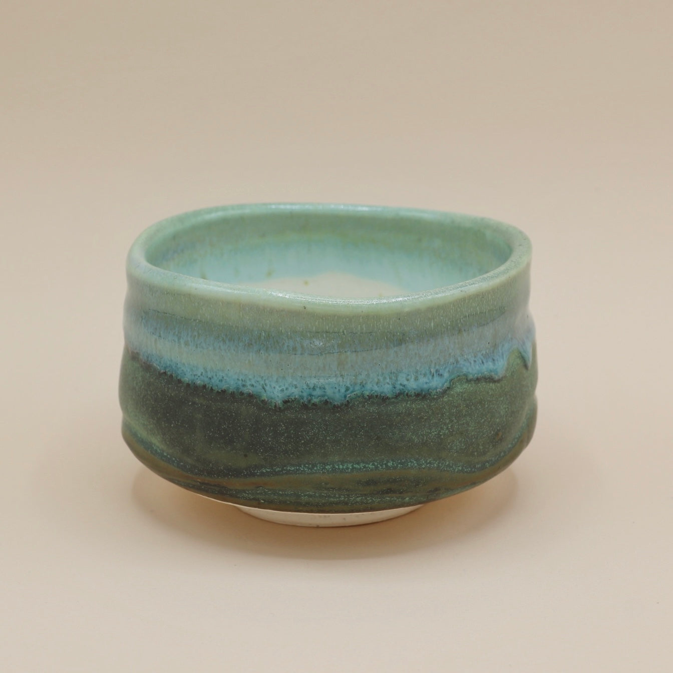 Green matcha cup with blue glaze