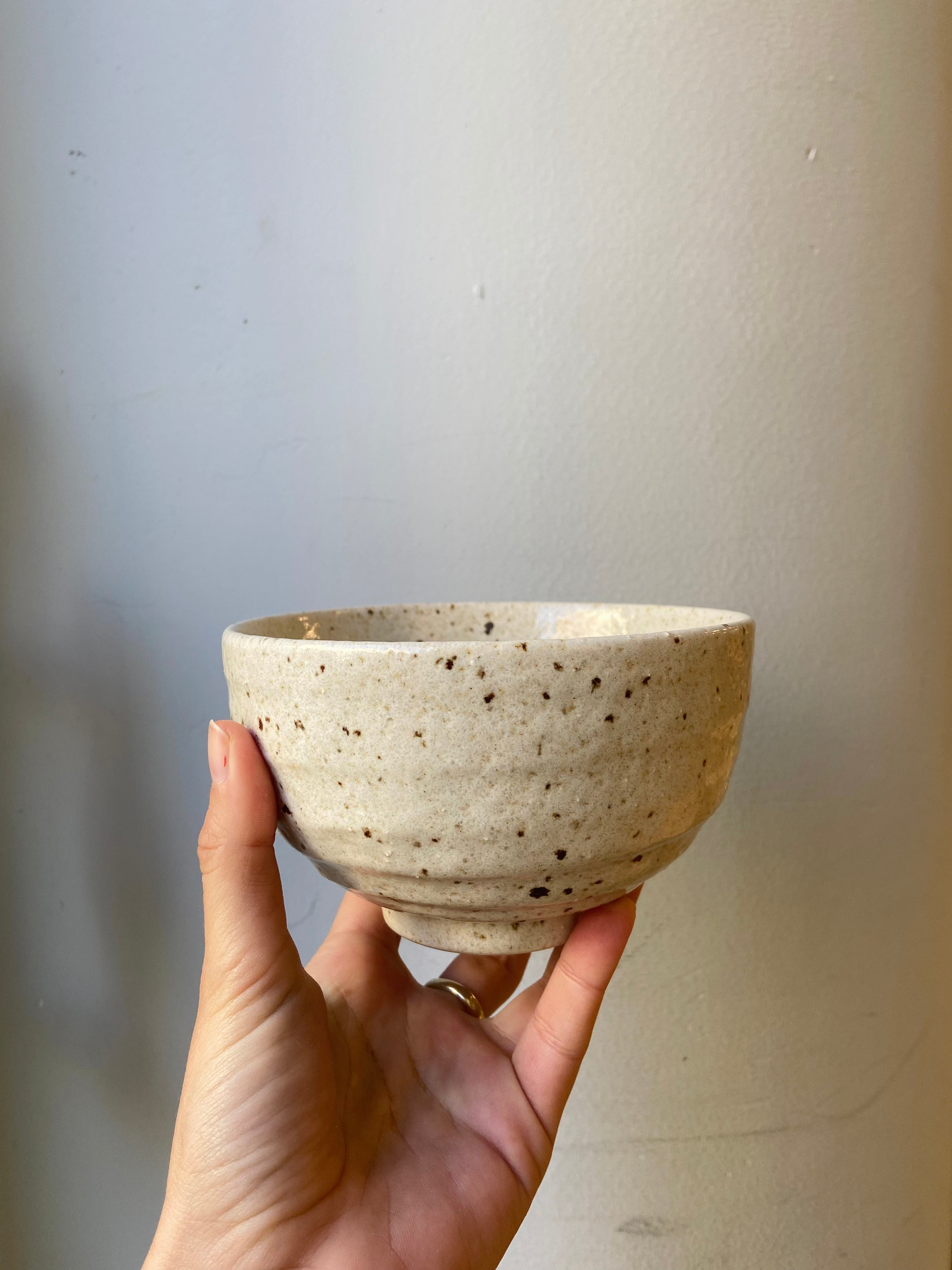 Ceramic bowl with brown chips