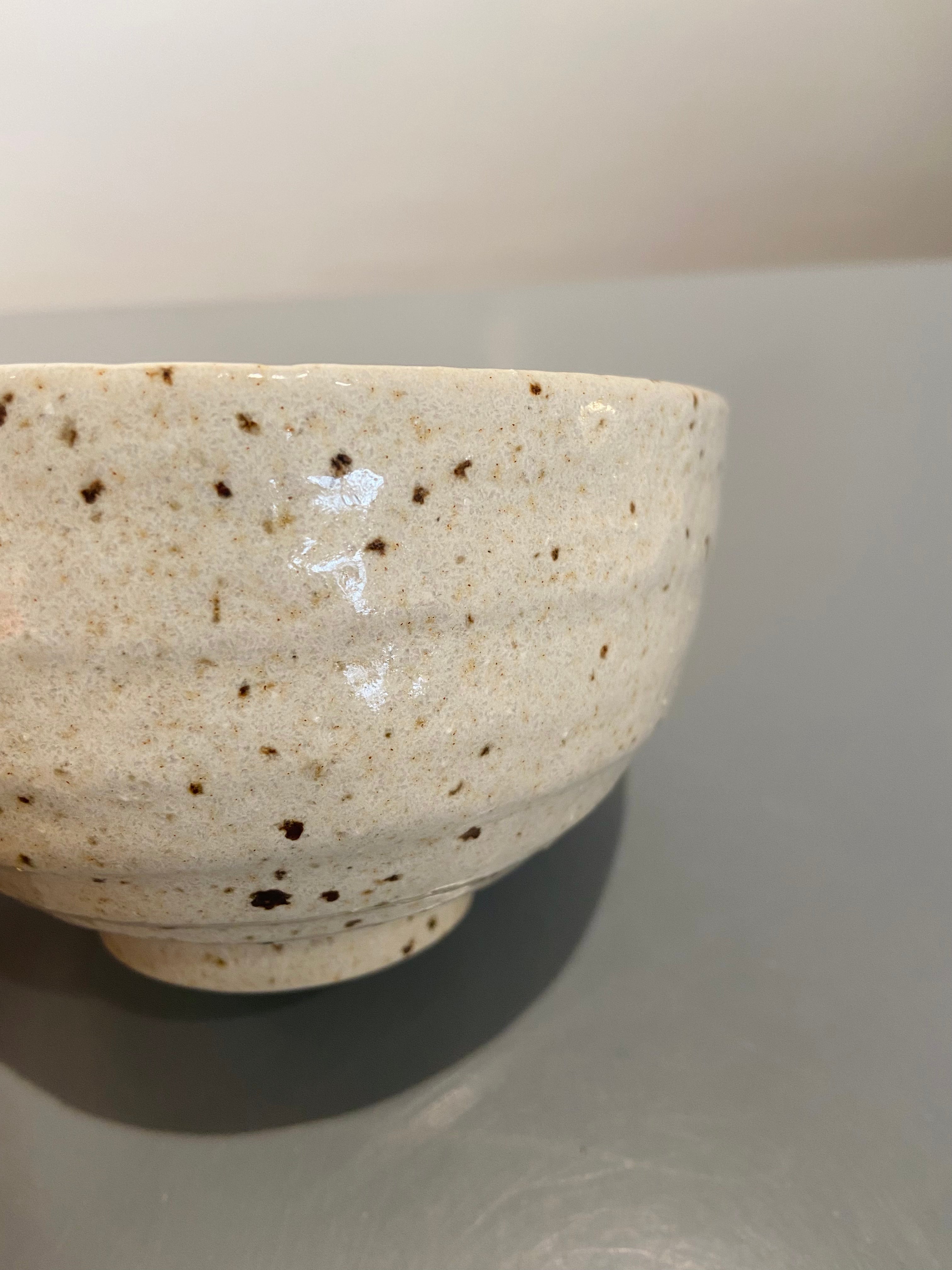 Ceramic bowl with brown chips